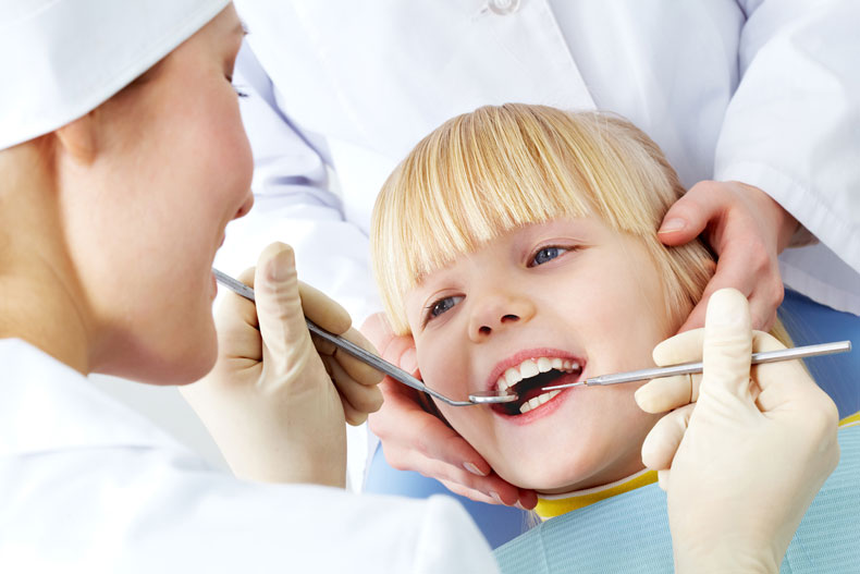 PIcture of a child's first dental visit