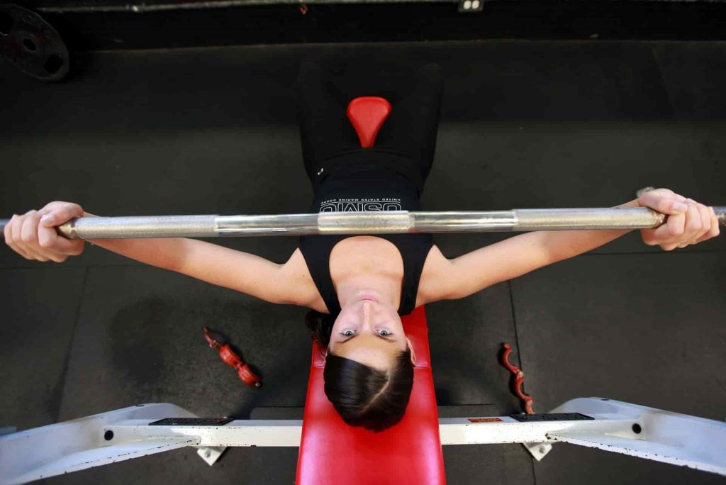 Woman doing a barbell press
