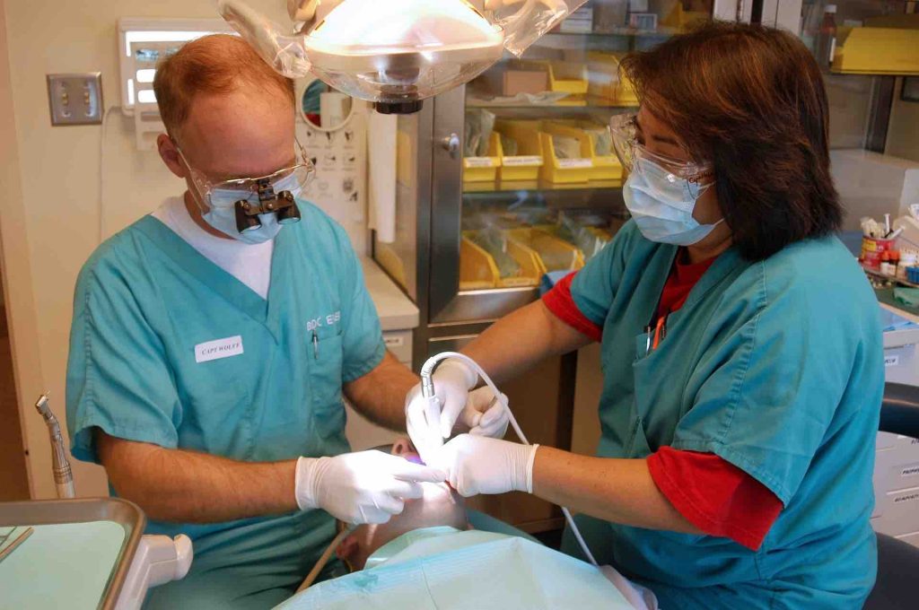 2 Dentists working on a patient